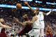 BOSTON, MA - MAY 15: Marcus Morris #13 of the Boston Celtics fouls LeBron James #23 of the Cleveland Cavaliers in the first half during Game Two of the 2018 NBA Eastern Conference Finals at TD Garden on May 15, 2018 in Boston, Massachusetts. NOTE TO USER