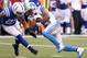 INDIANAPOLIS, IN - SEPTEMBER 11: Ameer Abdullah #21 of the Detroit Lions lowers his shoulder as he prepares to be tackled by Winston Guy #27 of the Indianapolis Colts during the third quarter of the game between the Detroit Lions and the Indianapolis Colt