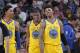 SACRAMENTO, CA - MARCH 31: Patrick McCaw #0, Kevon Looney #5 and Nick Young #6 of the Golden State Warriors face the Sacramento Kings on March 31, 2018 at Golden 1 Center in Sacramento, California. NOTE TO USER: User expressly acknowledges and agrees that