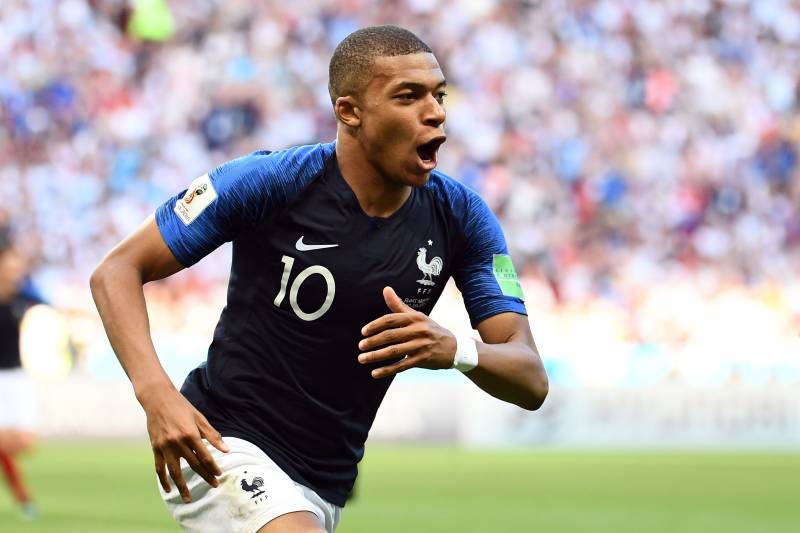 TOPSHOT - France's forward Kylian Mbappe celebrates after scoring their third goal during the Russia 2018 World Cup round of 16 football match between France and Argentina at the Kazan Arena in Kazan on June 30, 2018. (Photo by FRANCK FIFE / AFP) / RESTRI