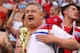 SAMARA, RUSSIA - JULY 07: An England fan holds a replica of the world cup trophy at the end of the 2018 FIFA World Cup Russia Quarter Final match between Sweden and England at Samara Arena on July 7, 2018 in Samara, Russia. (Photo by Robbie Jay Barratt