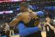 OKLAHOMA CITY, OK - FEBRUARY 13: LeBron James #23 of the Cleveland Cavaliers and Carmelo Anthony #7 of the Oklahoma City Thunder hug after the game on February 13, 2018 at Chesapeake Energy Arena in Oklahoma City, Oklahoma. NOTE TO USER: User expressly a