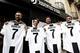 TOPSHOT - Juventus' supporters show their Cristiano Ronaldo's Juventus official Jerseys in front of the Juventus store on July 10, 2018 in Turin after Real Madrid announced today the transfer of Ronaldo to Italy's Juventus, with the Portuguese superstar s