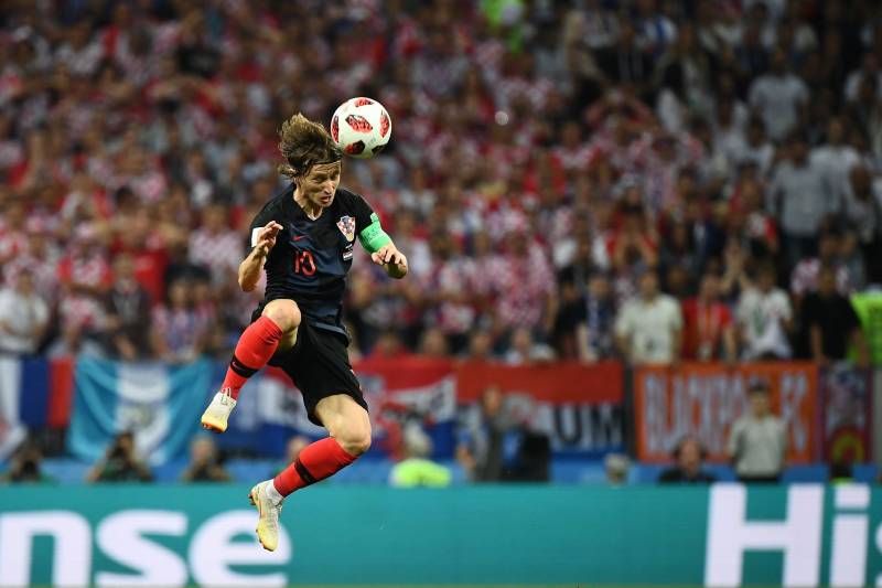 TOPSHOT - Croatia's midfielder Luka Modric heads the ball during the Russia 2018 World Cup semi-final football match between Croatia and England at the Luzhniki Stadium in Moscow on July 11, 2018. (Photo by FRANCK FIFE / AFP) / RESTRICTED TO EDITORIAL USE