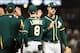 SAN FRANCISCO, CA - JULY 14: Stephen Piscotty #25 of the Oakland Athletics high-fives teammate Jed Lowrie #8 after defeating the San Francisco Giants 4-3 at AT&T Park on July 14, 2018 in San Francisco, California. (Photo by Stephen Lam/Getty Images)