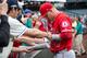 SEATTLE, WA - MAY 5: Mike Trout #27 of the Los Angeles Angels of Anaheim autographs a baseball for a fan before a game Mariners at Safeco Field on May 5, 2018 in Seattle, Washington. The Mariners won the game 9-8 in 11 innings. (Photo by Stephen Brashear/