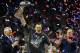 TOPSHOT - Tom Brady #12 of the New England Patriots holds the Vince Lombardi Trophy as Head coach Bill Belichick (R) looks on after defeating the Atlanta Falcons 34-28 in overtime during Super Bowl 51 at NRG Stadium on February 5, 2017 in Houston, Texas.