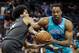 Jarrett Allen, left, defends Dwight Howard.