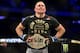 Georges St-Pierre dons the middleweight belt after beating Michael Bisping.