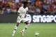 SINGAPORE, SINGAPORE - JULY 28: Timothy Weah #21 of Paris Saint Germain in action during the International Champions Cup match between Arsenal and Paris Saint Germain at the National Stadium on July 28, 2018 in Singapore. (Photo by Pakawich Damrongkiattis