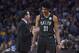 Nets coach Kenny Atkinson confers with Jarrett Allen.
