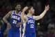 PHILADELPHIA, PA - JANUARY 15: Joel Embiid #21 and T.J. McConnell #12 of the Philadelphia 76ers react in the fourth quarter against the Toronto Raptors at the Wells Fargo Center on January 15, 2018 in Philadelphia, Pennsylvania. The 76ers defeated the Rap