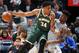 MINNEAPOLIS, MN - FEBRUARY 1: Giannis Antetokounmpo #34 of the Milwaukee Bucks handles the ball against Jimmy Butler #23 of the Minnesota Timberwolves during the game between the two teams on February 1, 2018 at Target Center in Minneapolis, Minnesota. NO