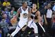 OAKLAND, CA - DECEMBER 11: Kevin Durant #35 of the Golden State Warriors dribbling the ball backs in on CJ McCollum #3 of the Portland Trail Blazers during an NBA basketball game at ORACLE Arena on December 11, 2017 in Oakland, California. NOTE TO USER: