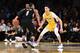 Lonzo Ball #2 of the Los Angeles Lakers defends against Damian Lillard #0 of the Portland Trail Blazers during the fourth quarter of a basketball game between the two teams at Staples Center on March 5, 2018 in Los Angeles, California.