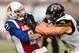 MONTREAL, QC - AUGUST 03: Defensive end Jason Neill #96 of the Hamilton Tiger-Cats (R) defends against quarterback Johnny Manziel #2 of the Montreal Alouettes (L) during the CFL game at Percival Molson Stadium on August 3, 2018 in Montreal, Quebec, Canad