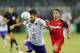 BUDAPEST, HUNGARY - AUGUST 2: (l-r) Mijusko Bojovic of Ujpest FC heads the ball in front of Wissam Ben Yedder of Sevilla FC during the UEFA Europa League Second Qualifying Round 2nd Leg match between Ujpest FC and Sevilla FC at Ferenc Szusza Stadium on Au