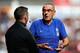 HUDDERSFIELD, ENGLAND - AUGUST 11: Chelsea manager Maurizio Sarri talks with the fourth official during the Premier League match between Huddersfield Town and Chelsea FC at John Smith's Stadium on August 11, 2018 in Huddersfield, United Kingdom. (Photo