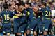 Boca Juniors' forward Cristian Pavon (C, hidden) celebrates with teammates after scoring a goal against Talleres during their Argentinian First Division Superliga football match at La Bombonera stadium, in Buenos Aires, on August 12, 2018. (Photo by ALEJA