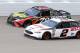 BROOKLYN, MI - AUGUST 12: Martin Truex Jr., driver of the #78 5-hour ENERGY/Bass Pro Shops Toyota, and Brad Keselowski, driver of the #2 Discount Tire Ford, race during the Monster Energy NASCAR Cup Series Consmers Energy 400 at Michigan International Spe