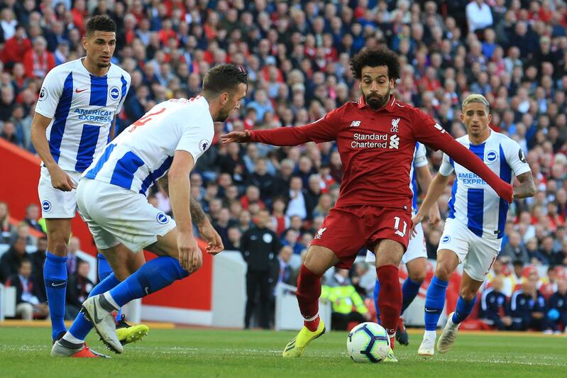 Brighton's Irish defender Shane Duffy (L) vies with Liverpool's Egyptian midfielder Mohamed Salah during the English Premier League football match between Liverpool and Brighton and Hove Albion at Anfield in Liverpool, north west England on August 25, 201