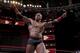 Pictured: Bobby Lashley pointing out the two people in the audience who are invested in his match.