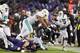BALTIMORE, MD - OCTOBER 26: Running Back Alex Collins #34 of the Baltimore Ravens is tackled by defensive tackle Ndamukong Suh #93 of the Miami Dolphins in the fourth quarter at M&T Bank Stadium on October 26, 2017 in Baltimore, Maryland. (Photo by Rob Ca