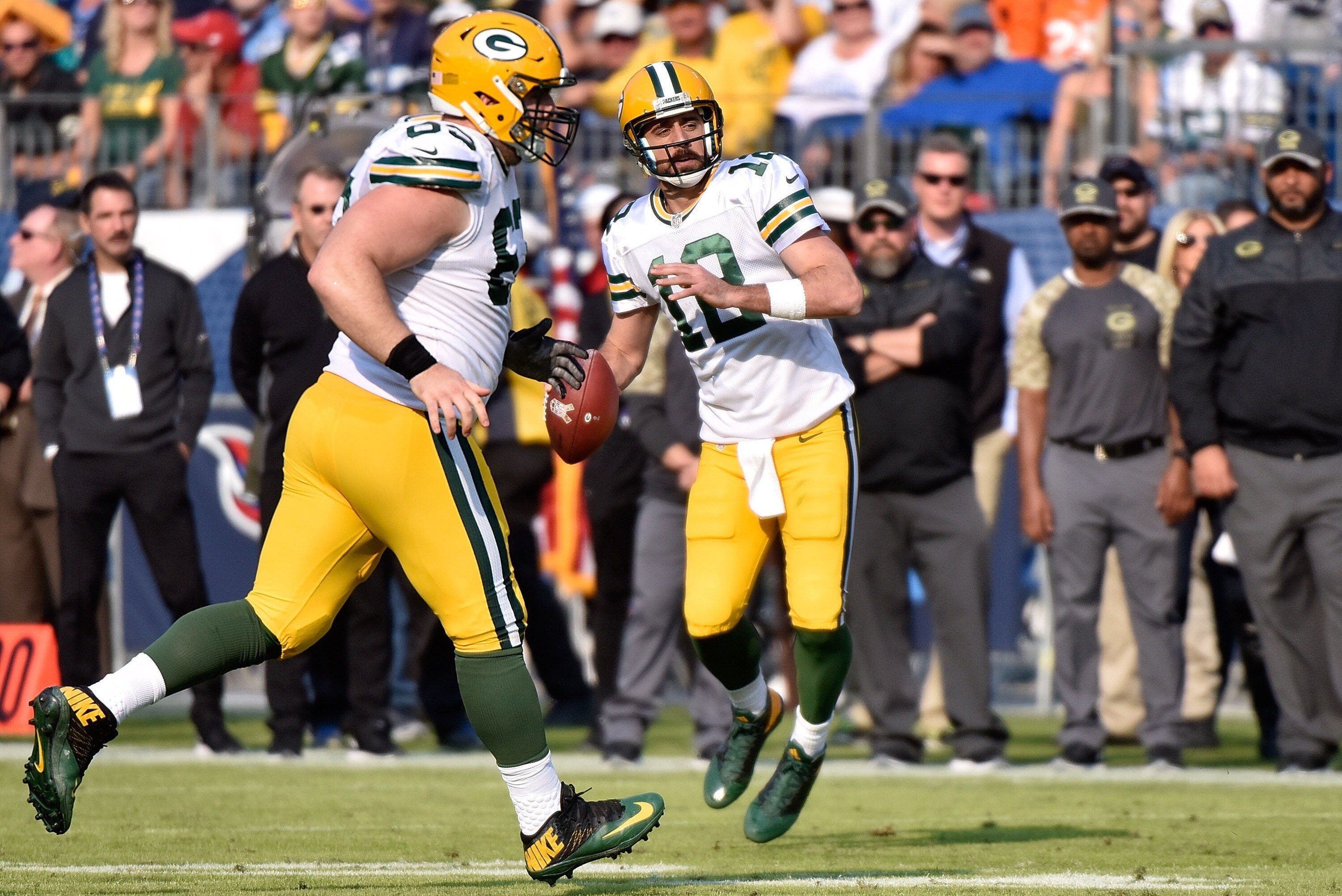NASHVILLE, TN - NOVEMBER 13:  Quarterback Aaron Rodgers #12 of the Green Bay Packers rolls out to throw a hail mary pass against the Tennessee Titans at the end of the first half at Nissan Stadium on November 13, 2016 in Nashville, Tennessee.  (Photo by F