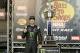BRISTOL, TN - AUGUST 18: Kurt Busch, driver of the #41 Monster Energy/Haas Automation Ford, poses with the trophy in Victory Lane after winning the Monster Energy NASCAR Cup Series Bass Pro Shops NRA Night Race at Bristol Motor Speedway on August 18, 201