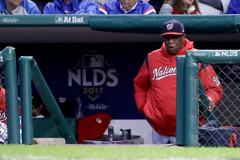 CHICAGO, IL - OCTOBER 11: Manager Dusty Baker of the Washington Nationals looks on from the dugout in the sixth inning during game four of the National League Division Series against the Chicago Cubs at Wrigley Field on October 11, 2017 in Chicago, Illin