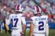 ORCHARD PARK, NY - AUGUST 26: Josh Allen #17 and Nathan Peterman #2 of the Buffalo Bills speak with coaching staff during the preseason game against the Cincinnati Bengals at New Era Field on August 26, 2018 in Orchard Park, New York. Cincinnati defeats