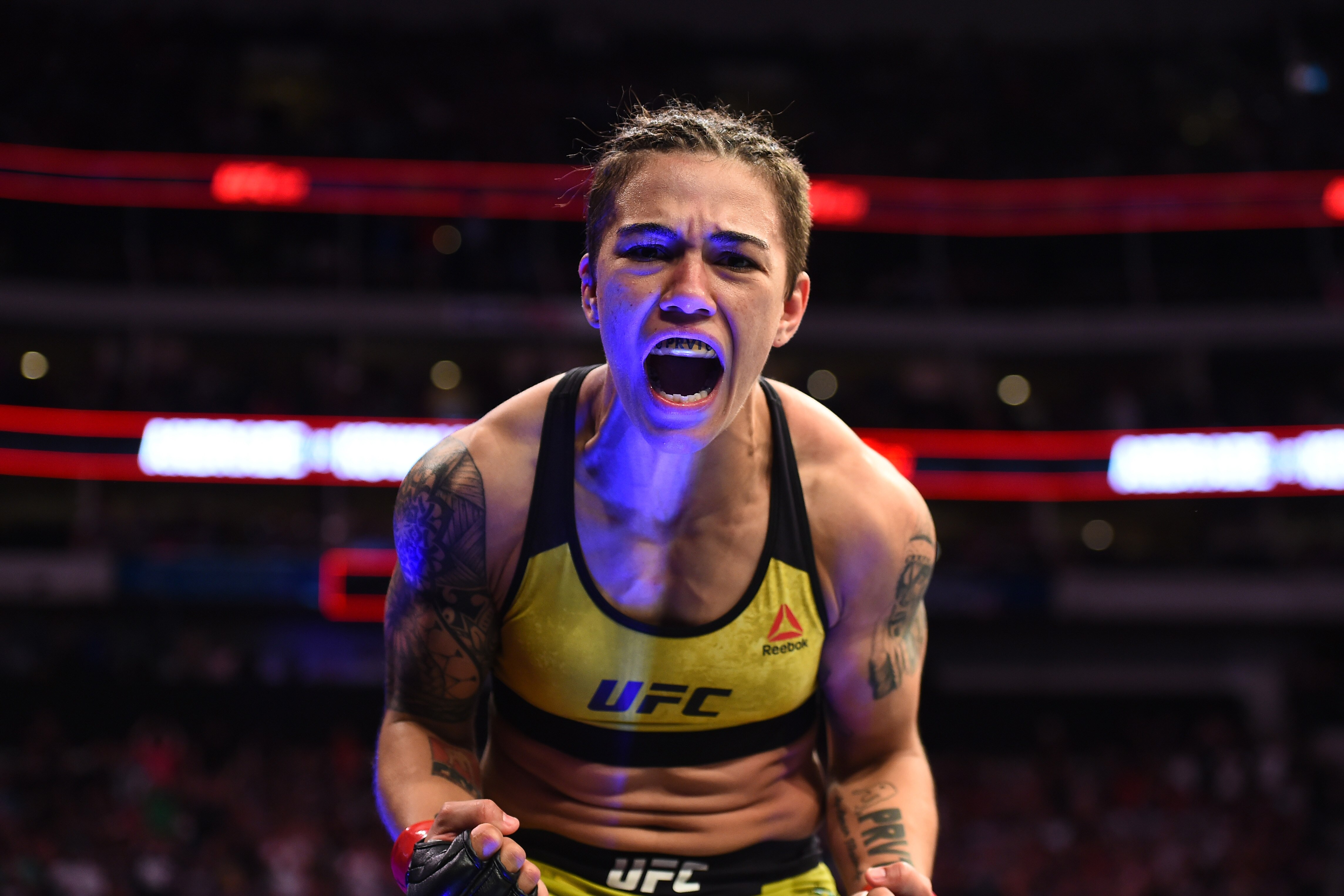 DALLAS, TX - SEPTEMBER 08:  Jessica Andrade of Brazil celebrates after knocking out Karolina Kowalkiewicz of Poland in their women's strawweight fight during the UFC 228 event at American Airlines Center on September 8, 2018 in Dallas, Texas. (Photo by Jo