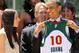 WASHINGTON - JUNE 29: U.S. President Barack Obama (2nd R) receives a jersey from guard Sue Bird (L) of the Seattle Storm Coach Brian Agler (2nd L) looks on during a Rose Garden event June 29, 2011 at the White House in Washington, DC. Obama hosted the WN