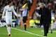 Real Madrid's Portuguese coach Jose Mourinho (R) speaks with Real Madrid's German midfielder Mesut Ozil during the UEFA Champions League second leg semi-final football match Real Madrid against Bayern Munich at the Santiago Bernabeu stadium in Madrid on