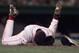 Florie grasped his face immediately after tumbling to the ground.