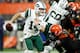 CLEVELAND, OH - SEPTEMBER 20: Sam Darnold #14 of the New York Jets avoids a tackle by Joe Schobert #53 of the Cleveland Browns during the fourth quarter at FirstEnergy Stadium on September 20, 2018 in Cleveland, Ohio. (Photo by Joe Robbins/Getty Images)
