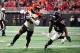 ATLANTA, GA - SEPTEMBER 30: Tyler Boyd #83 of the Cincinnati Bengals runs past Desmond Trufant #21 of the Atlanta Falcons after a catch during the third quarter at Mercedes-Benz Stadium on September 30, 2018 in Atlanta, Georgia. (Photo by Scott Cunningham