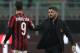 MILAN, ITALY - DECEMBER 13: Andre Silva (L) of AC Milan shakes hands with AC Milan coach Gennaro Gattuso (R) at the end of the Tim Cup match between AC Milan and Hellas Verona FC at Stadio Giuseppe Meazza on December 13, 2017 in Milan, Italy. (Photo by