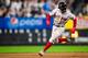 NEW YORK, NY - OCTOBER 8: Mookie Betts #50 of the Boston Red Sox runs toward third base during the fourth inning of game three of the American League Division Series against the New York Yankees on October 8, 2018 at Yankee Stadium in the Bronx borough of