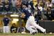 MILWAUKEE, WI - OCTOBER 04: Mike Moustakas #18 of the Milwaukee Brewers hits a walk off single in the tenth inning to win Game One of the National League Division Series 3-2 over the Colorado Rockies at Miller Park on October 4, 2018 in Milwaukee, Wiscon