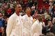 MIAMI, FL - JANUARY 6: Chris Bosh #1 of the Miami Heat, Hassan Whiteside #21 of the Miami Heat and Dwyane Wade #3 of the Miami Heat stand for the national anthem before the game against the New York Knicks on January 6, 2016 at American Airlines Arena in