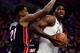 PHILADELPHIA, PA - FEBRUARY 02: Joel Embiid #21 (R) of the Philadelphia 76ers is guarded by Hassan Whiteside #21 of the Miami Heat during the first quarter at the Wells Fargo Center on February 2, 2018 in Philadelphia, Pennsylvania. The Philadelphia 76ers