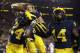 ANN ARBOR, MI - OCTOBER 13: Lavert Hill #24 of the Michigan Wolverines celebrates his second half touchdown with Josh Metellus #14 and Chase Winovich #15 after intercepting a pass against the Wisconsin Badgers on October 13, 2018 at Michigan Stadium in An