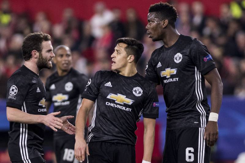 SEVILLE, SPAIN - FEBRUARY 21:  ALEXIS SANCHEZ (C ), JUAN MATA (L ) and PAUL POGBA (R ) argue after missing a chance at goal during the UEFA Champions League Round of 16 First Leg match between Sevilla FC and Manchester United at Estadio Ramon Sanchez Pizj