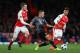 LONDON, ENGLAND - MARCH 07: Rafinha of Bayern Munich gets past Aaron Ramsey and Alex Oxlade-Chamberlain of Arsenal during the UEFA Champions League Round of 16 second leg match between Arsenal FC and FC Bayern Muenchen at Emirates Stadium on March 7, 2017