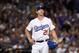 LOS ANGELES, CA - OCTOBER 15: Pitcher Walker Buehler #21 of the Los Angeles Dodgers reacts after giving up a two-run home run during the seventh inning of Game Three of the National League Championship Series against the Milwaukee Brewers at Dodger Stadi