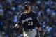 LOS ANGELES, CA - OCTOBER 17: Christian Yelich #22 of the Milwaukee Brewers reacts after striking out swinging during the third inning of Game Five of the National League Championship Series against the Los Angeles Dodgers at Dodger Stadium on October 17,