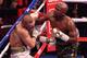 LAS VEGAS, NV - AUGUST 26: (R-L) Floyd Mayweather Jr. punches Conor McGregor in their super welterweight boxing match at T-Mobile Arena on August 26, 2017 in Las Vegas, Nevada. Mayweather won by 10th-round TKO. (Photo by Jeff Bottari/Zuffa LLC/Zuffa LLC