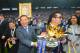 LEICESTER, ENGLAND - MAY 07: Leceister City owner Vichai Srivaddhanaprabha (L) and son Aiyawatt Srivaddhanaprabha hold the Premier League Trophy after the Barclays Premier League match between Leicester City and Everton at The King Power Stadium on May 7