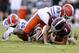 STARKVILLE, MS - SEPTEMBER 29: Nick Fitzgerald #7 of the Mississippi State Bulldogs is sacked by Jachai Polite #99 of the Florida Gators and Jabari Zuniga #92 during a game at Davis Wade Stadium on September 29, 2018 in Starkville, Mississippi. (Photo by